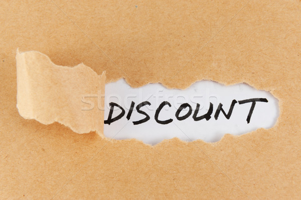 Teared paper with discount word Stock photo © raywoo
