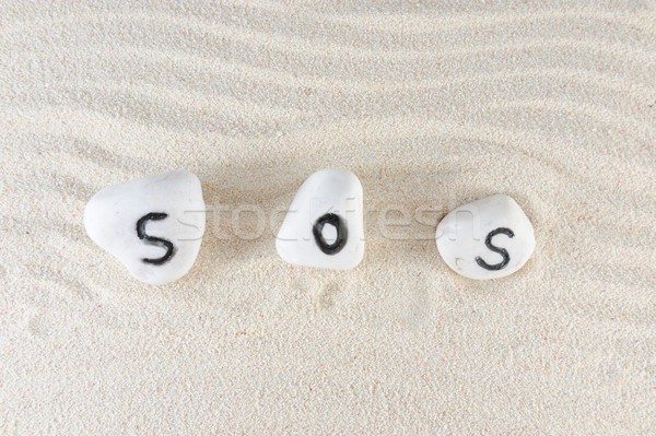 Sos woord groep stenen zand strand Stockfoto © raywoo