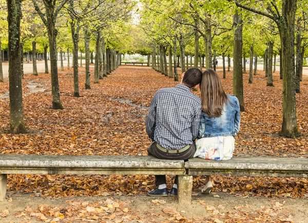 Young Couple Sitting on a Bench in a Park in Autumn Stock photo © RazvanPhotography