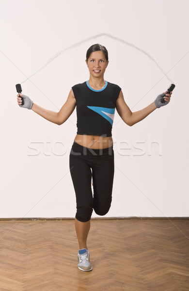 [[stock_photo]]: Sautant · corde · jeune · femme · femme · fitness · gymnase