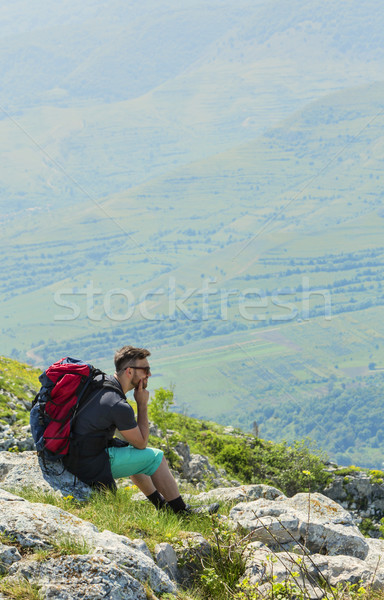 Hiker Resting on Rocks in Mountains Stock photo © RazvanPhotography