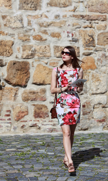 Young Woman Walking with a Tablet Stock photo © RazvanPhotography