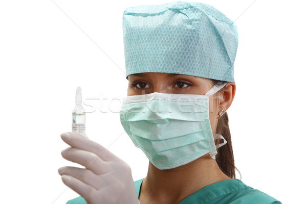 Kobiet lekarza fiolka patrząc kobieta ręce Zdjęcia stock © RazvanPhotography