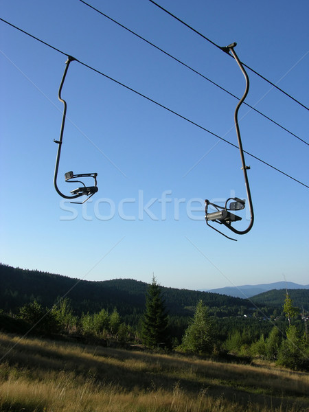 Chair-lift and the blue sky Stock photo © rbiedermann