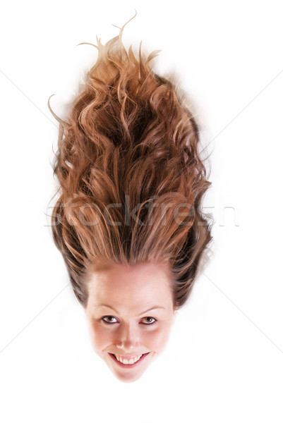 Pretty girl with wild hair rising upward. Stock photo © rcarner