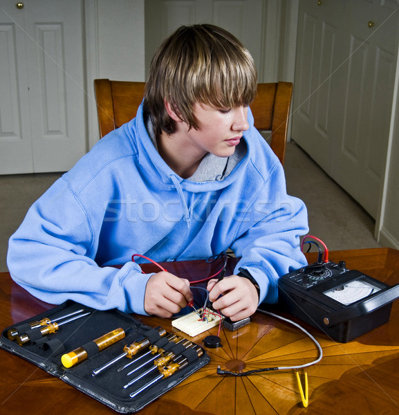 Teenager using a voltmeter Stock photo © rcarner