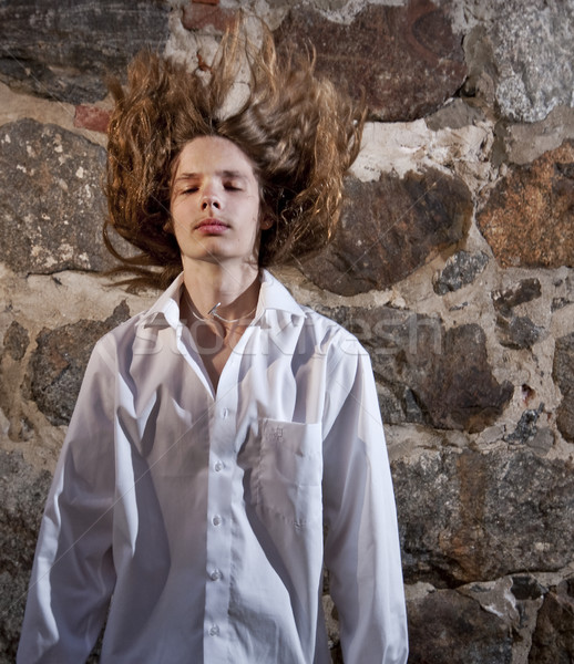 Nehéz rocker tini férfi modell hosszú haj pózol Stock fotó © Reaktori