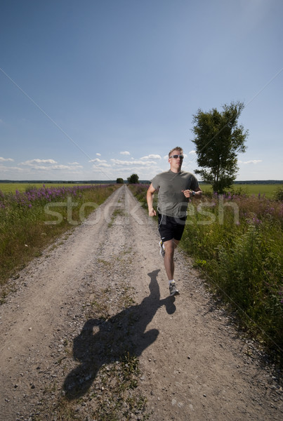Uruchomiony człowiek mężczyzna długo prosto Zdjęcia stock © Reaktori