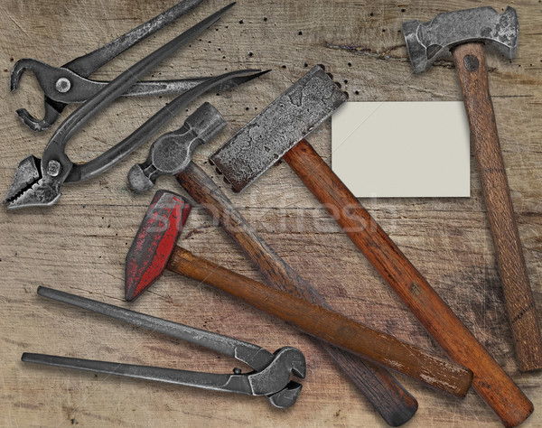 blacksmith tools and business card over bench Stock photo © RedDaxLuma