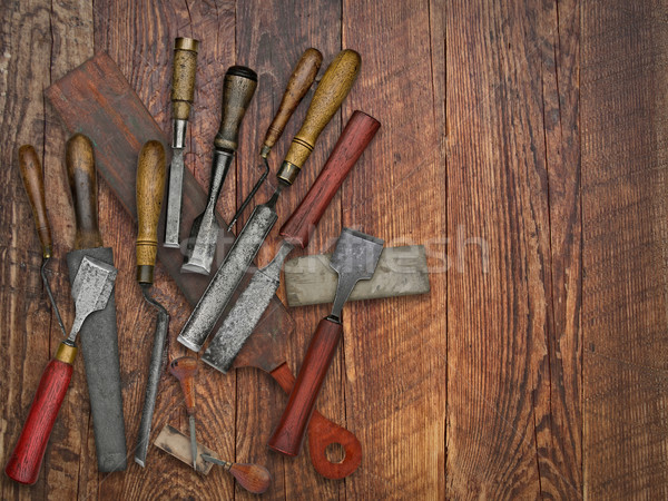 vintage chisels and stones collage over old wooden bench Stock photo © RedDaxLuma