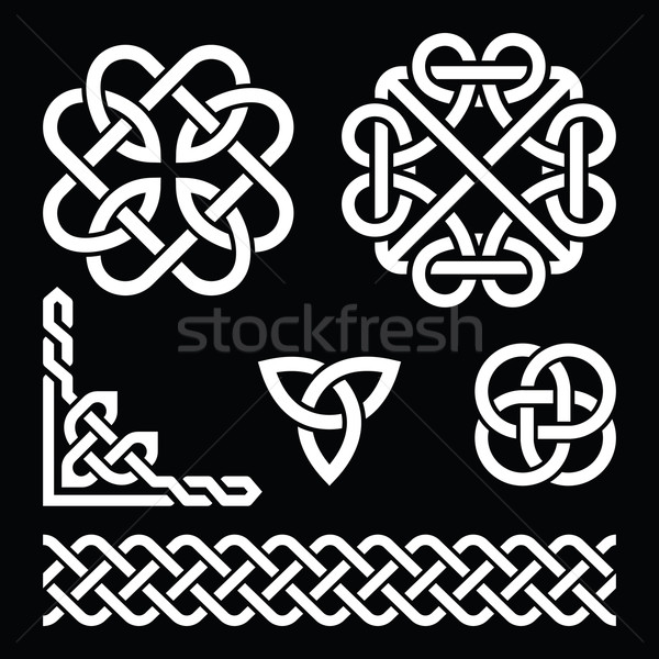 Celtic Irish knots, braids and patterns in white on black background Stock photo © RedKoala