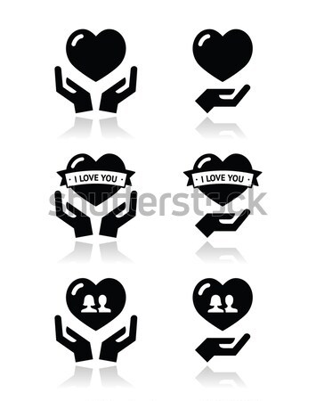 Rainbow, gay and lesbian symbols in heart with hands Stock photo © RedKoala