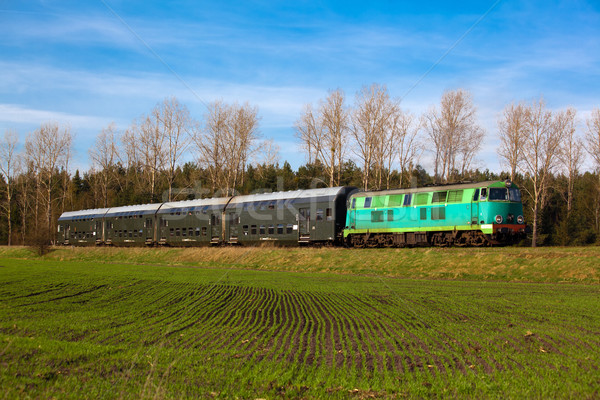 Passenger train passing through countryside Stock photo © remik44992