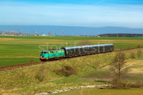 Passenger train passing through countryside Stock photo © remik44992