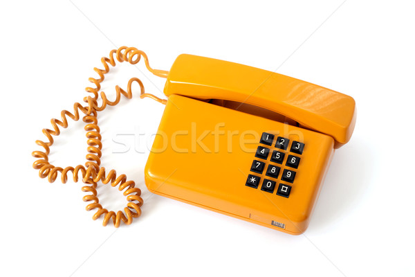 Vecchio telefono arancione telefono isolato bianco Foto d'archivio © remik44992
