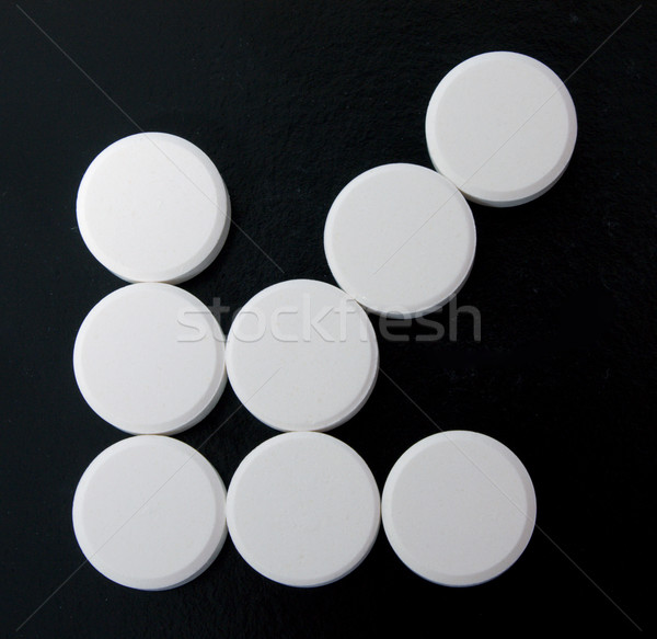 arrow of white tablets Stock photo © restyler