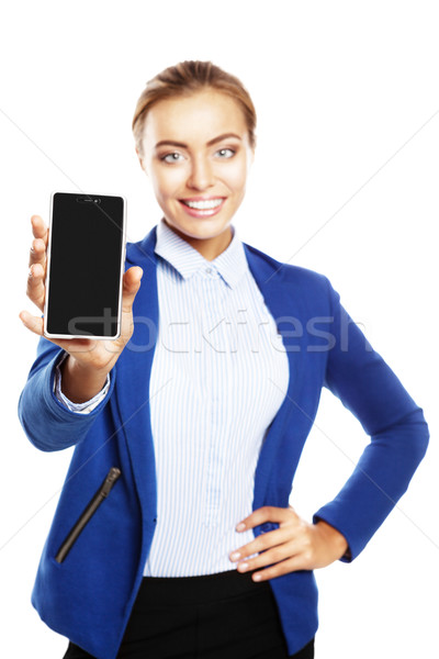 Businesswoman showing a blank smartphone screen Stock photo © restyler