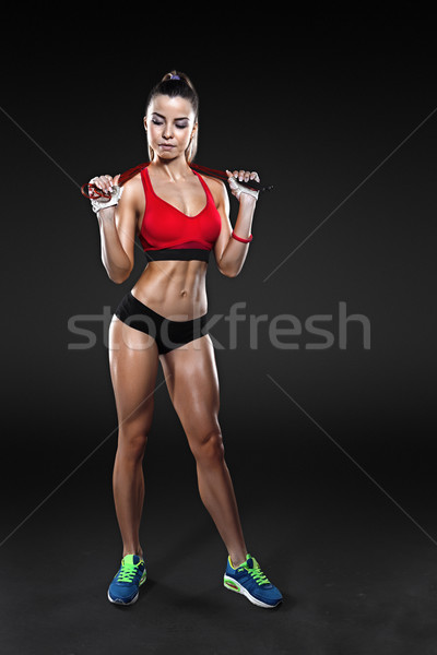 Sportswoman exercising with a resistance band. Black and white photo Stock photo © restyler