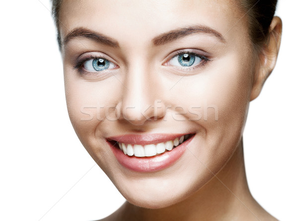 Stock photo: Close up portrait of beautiful young happy smiling woman.