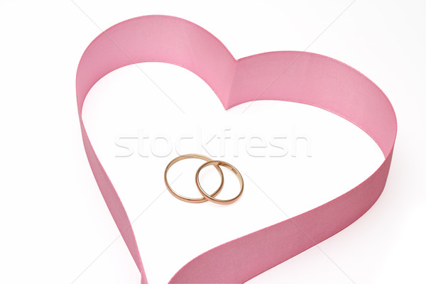 Wedding rings in heart from a tape Stock photo © restyler