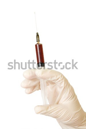 Hand with red ampule Stock photo © restyler