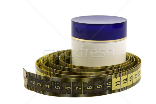 Jar with cosmetic cream and measuring tape Stock photo © restyler