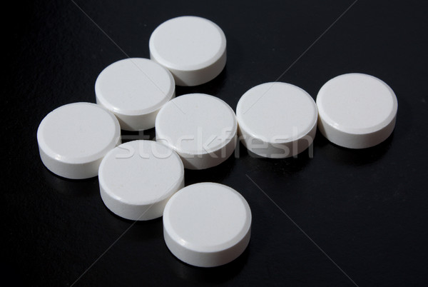 arrow of white tablets Stock photo © restyler
