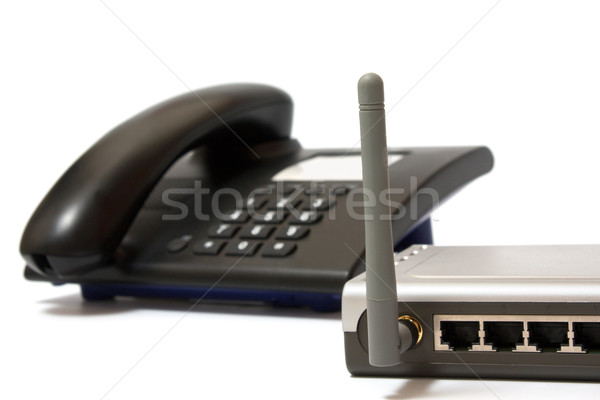 Stock photo: Office phone and wi-fi router