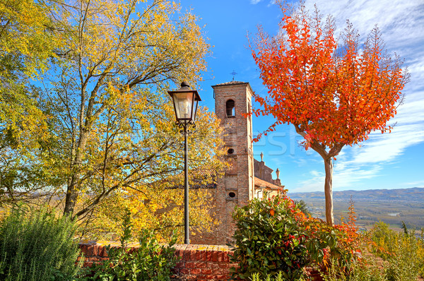 Old belfry among autumnal trees in Piedmont, Italy. Stock photo © rglinsky77