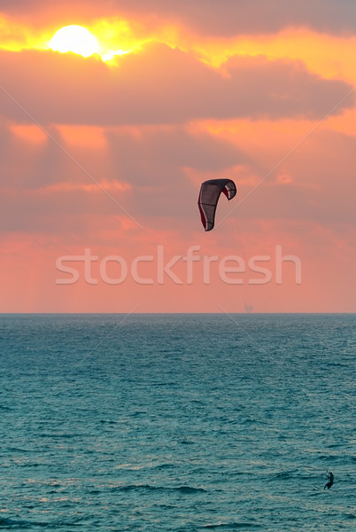 Kitesurfer on Mediterranean sea at sunset in Israel. Stock photo © rglinsky77