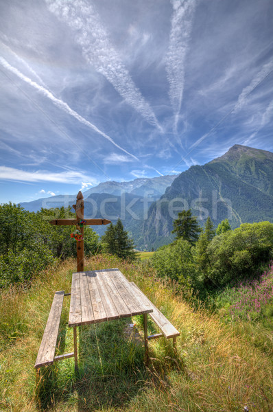 Wooden cross on alpine meadow. Stock photo © rglinsky77