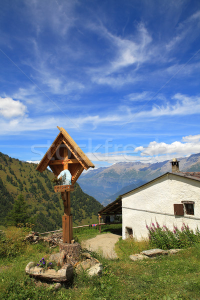 Wooden cross near rural house in Alps. Stock photo © rglinsky77