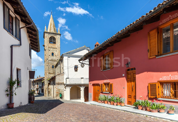 Colorful houses and old church in small italian town. Stock photo © rglinsky77