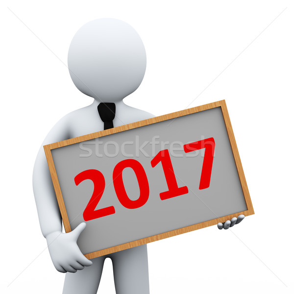 Stock photo: 3d businessman holding 2017 board