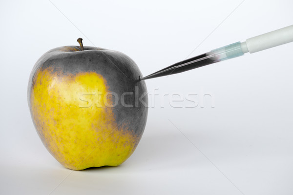 Killing an yellow apple Stock photo © rmbarricarte