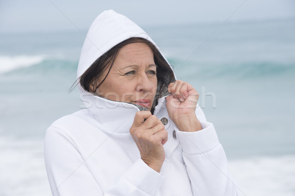 Woman freezing autumn at ocean Stock photo © roboriginal