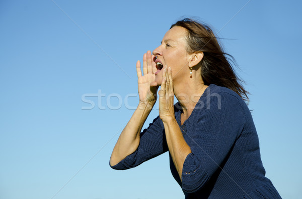 Attractive mature  woman shouting out loud Stock photo © roboriginal