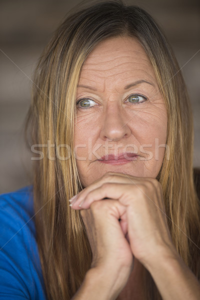 Thoughtful lonely woman folded hands Stock photo © roboriginal