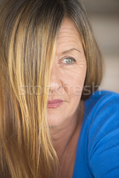Confident woman hair covering face portrait Stock photo © roboriginal