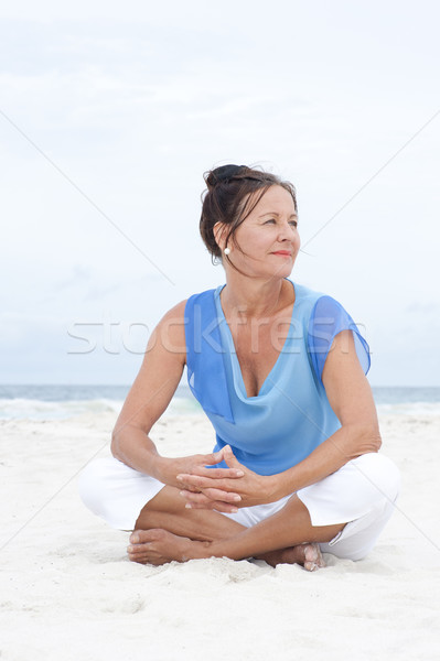Portrait friendly mature woman beach Stock photo © roboriginal