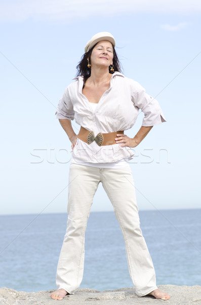 Attractive mature woman ocean background Stock photo © roboriginal