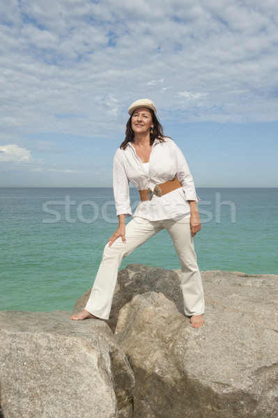 Attractive mature woman ocean isolated Stock photo © roboriginal