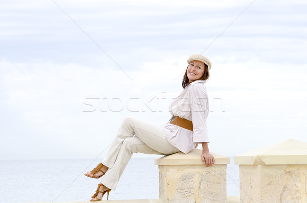 Attractive happy retired woman high heels beach Stock photo © roboriginal