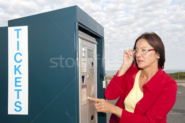 Woman at ticket machine Stock photo © roboriginal