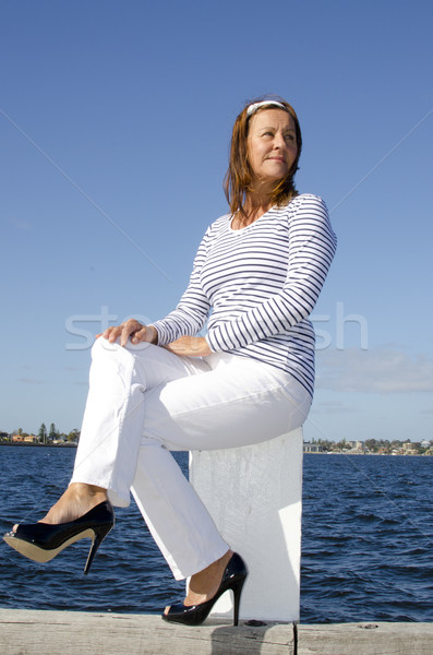 Pretty mature woman marine background Stock photo © roboriginal