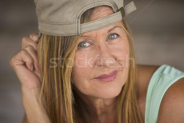 Confident attractive sporty mature woman cap Stock photo © roboriginal