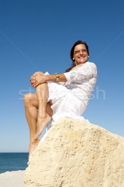 Mature woman ocean holiday Stock photo © roboriginal