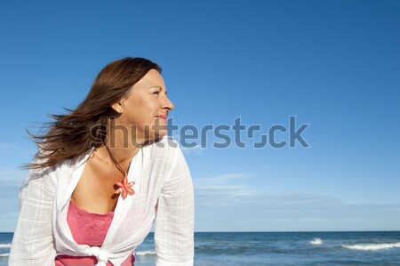 Lonely depressed senior woman sky background Stock photo © roboriginal