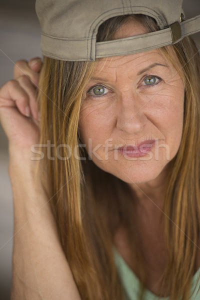 Confident fit mature woman sporty cap Stock photo © roboriginal