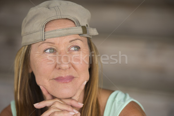 Active fit smiling mature woman sporty cap Stock photo © roboriginal